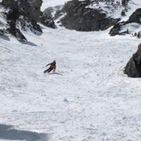 JD skiing out of a wider section of Silver Couloir